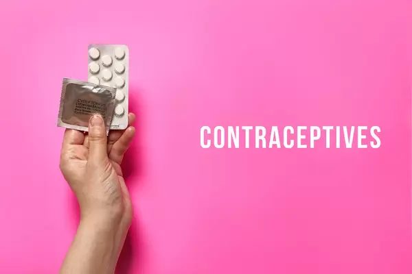 Female holding contraceptives