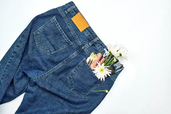 Female jeans pants and make-up tools