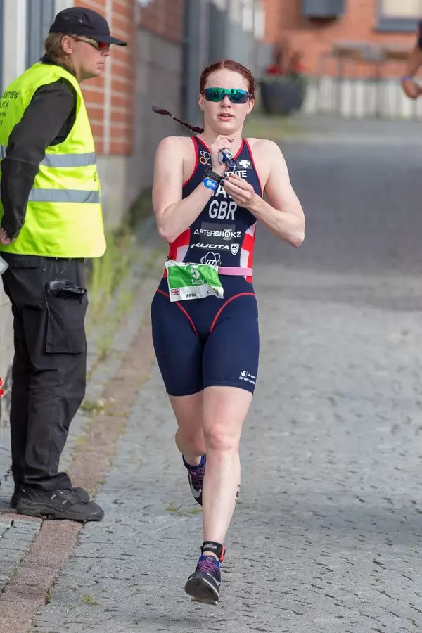 Female profi athlete Lucy Hall at the Ironman 70.3 in Finland, runs the last marathon stage of the triathlon competition