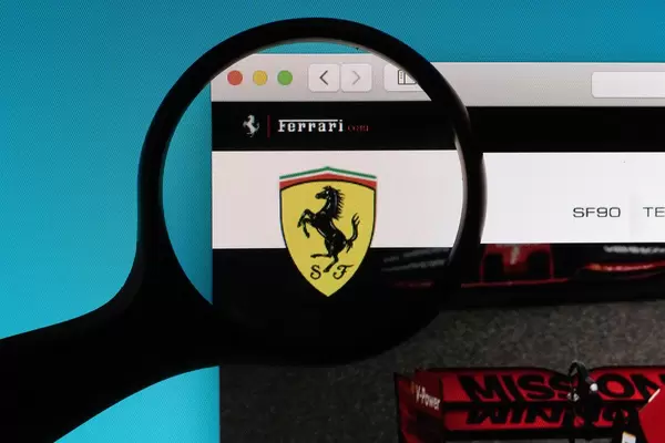 Ferrari logo under magnifying glass