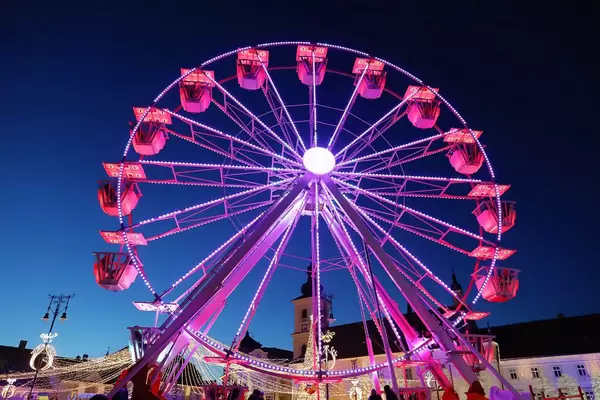 Ferris wheel at Christmas fair, red lights