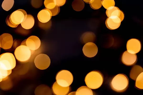 Festive background with blurred garland glow