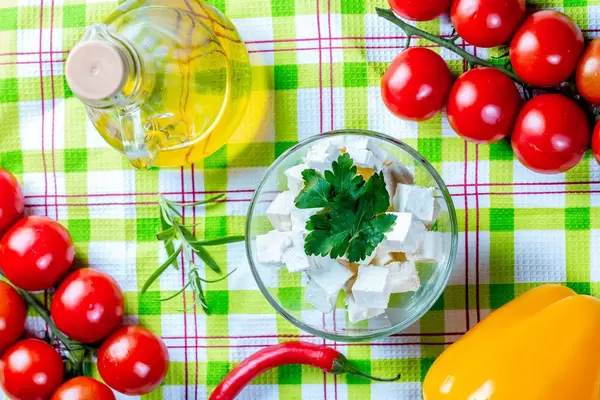 Feta cheese with vegetables and olive oil.  Flip 2019