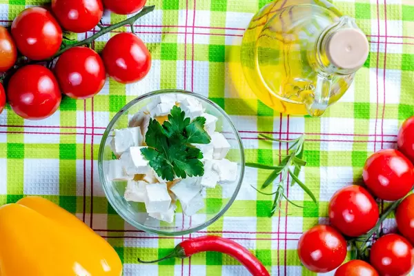 Feta cheese with vegetables and olive oil.