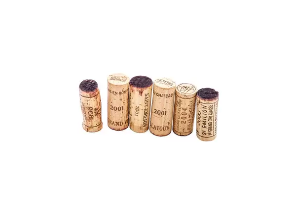 Few rare wine corks on white background