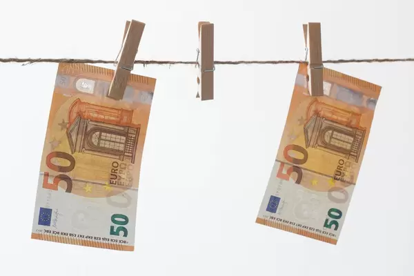 Fifty euros bills hanging on the rope