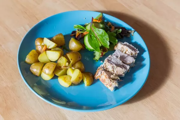 Fillet of pork with potatoes and corn salad