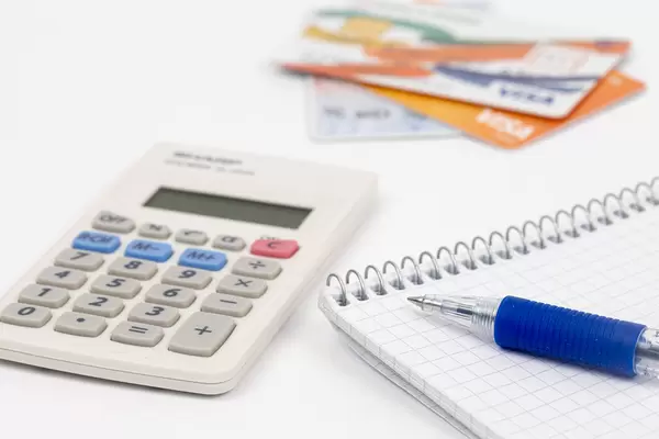 Finance concept wit Calculator and payment cards in the background