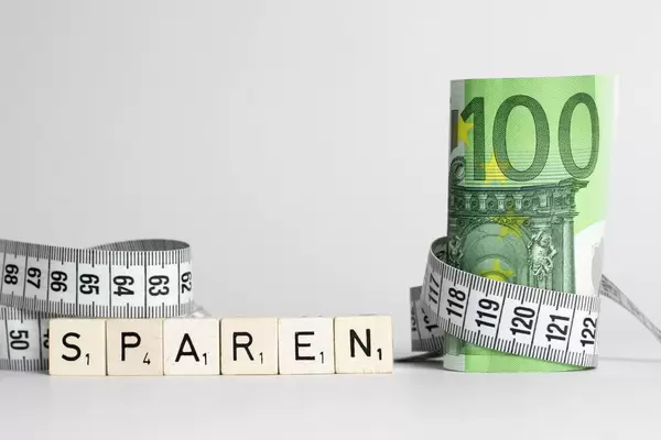 Financial concept, measuring money isolated on white