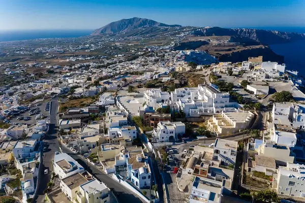 Firá, capital of Greek island Santorini, seen from above with white-washed houses and volcanic cliffs