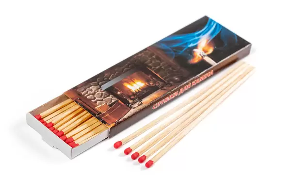 Fireplace matches in a box on a white background