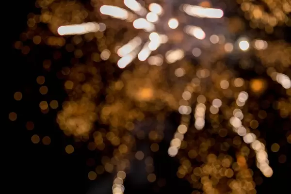 Fireworks photographed in the night sky on New Year's Eve with bokeh