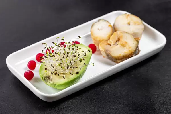 Fish slices with avocado, micro-green onions and cranberries (Flip 2019)