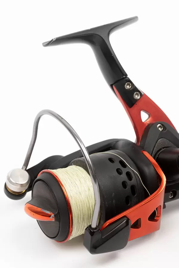 Fishing Reel isolated above white background