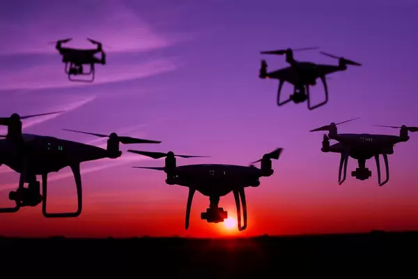 Five drones in the sky at sunset (Flip 2019)