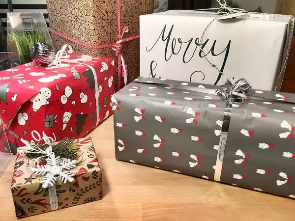 Five gifts in different sizes wrapped for Christmas