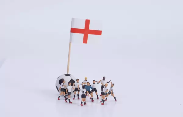 Flag of England and group of football players