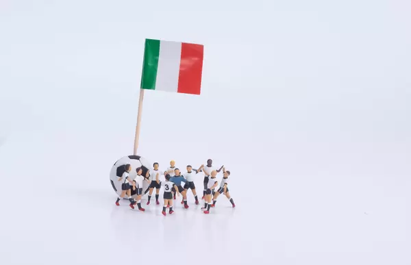 Flag of Italy and group of football players