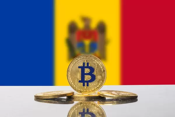 Flagge von Moldawien mit Unschärfe mit goldenen Bitcoin-Münzen im Vordergrund
