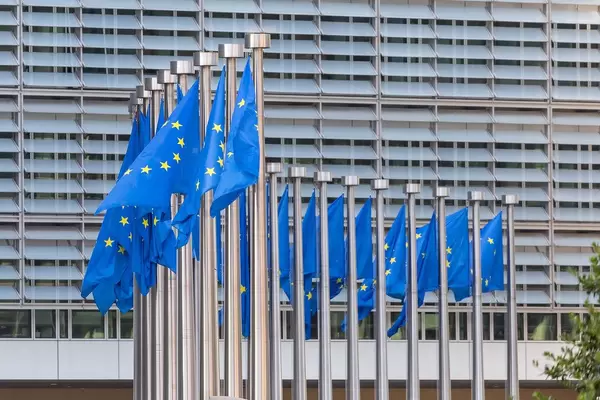Flags of the European Union in front of the Berlaymont Building in Brussels, Belgium