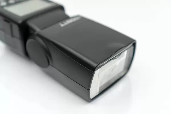 Flash light head for photography isolated on the white background (Flip 2020)