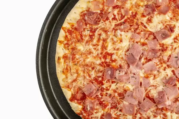 Flat lay above Baked Pizza with Ham