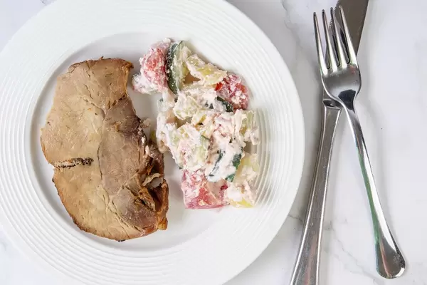 Flat lay above Baked Pork Chop with Serbian Sopska Salad (Flip 2019)
