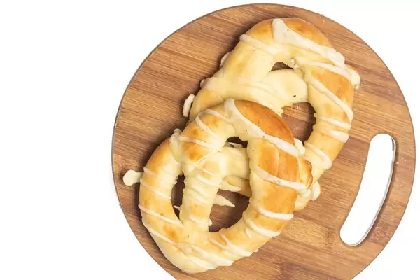 Flat lay above bakery Pretzels isolated on the wooden board