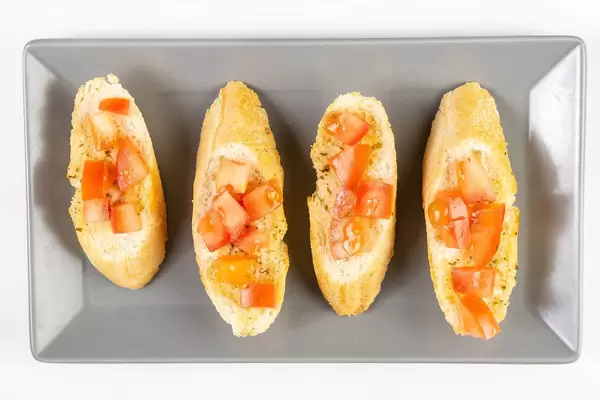 Flat lay above Bread Baguettes with Tomato and Tartar Sauce