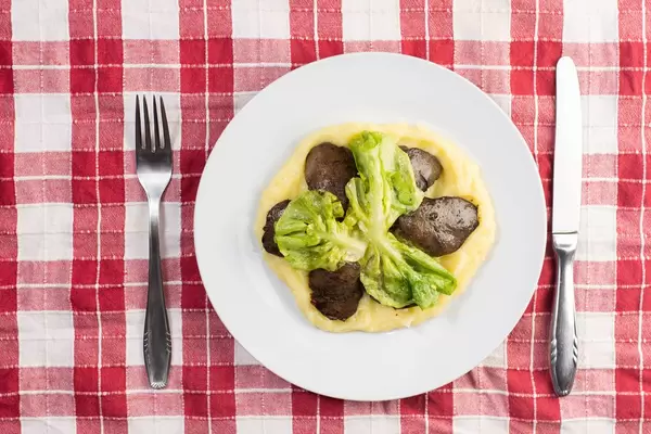 Flat lay above Chicken Liver and Mashed Potatoes with Green Salad