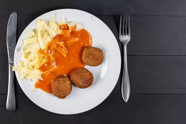 Flat Lay above Chicken Meat Meatballs with Tomato Sauce and Pasta (Flip 2019)