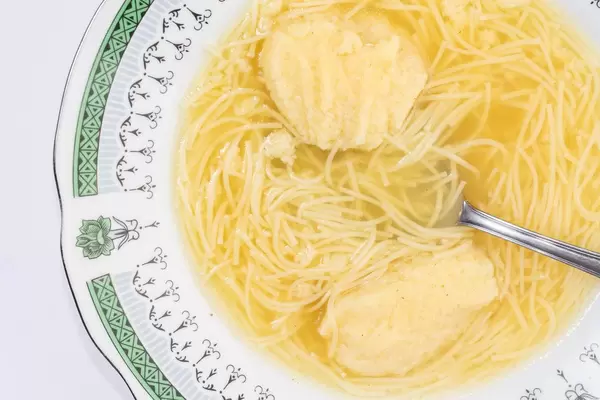 Flat lay above Chicken soup with Dumplings
