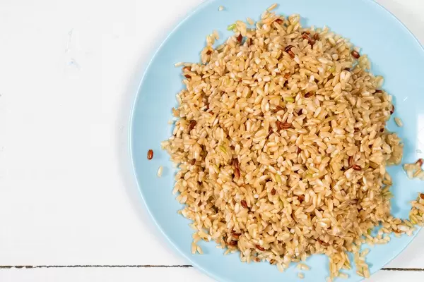 Flat lay above Cooked Integral Rice in the blue plate