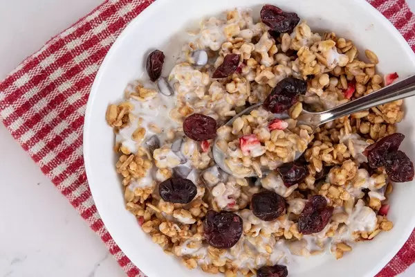 Flat lay above Cornflakes with Chocolate Strawberries and Cranberries