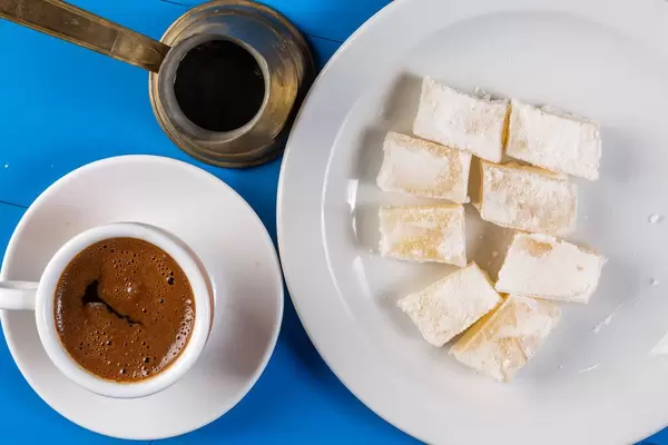 Flat lay above Cup of Coffee with Turkish Delight (Flip 2019)