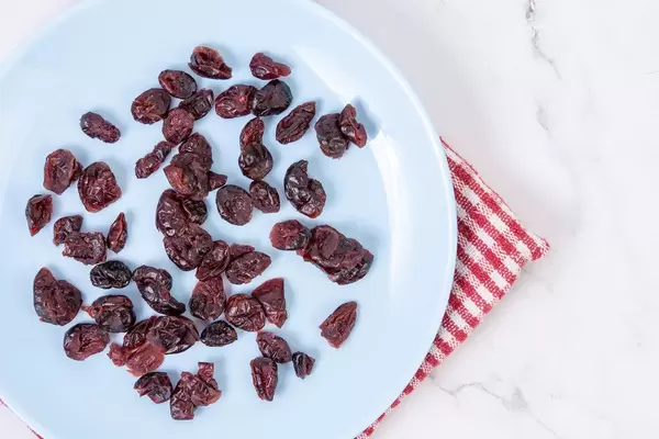 Flat lay above Dried Cranberries on the blue plate (Flip 2019)