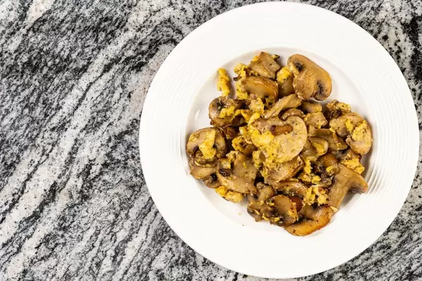 Flat lay above fried Eggs and Mushrooms