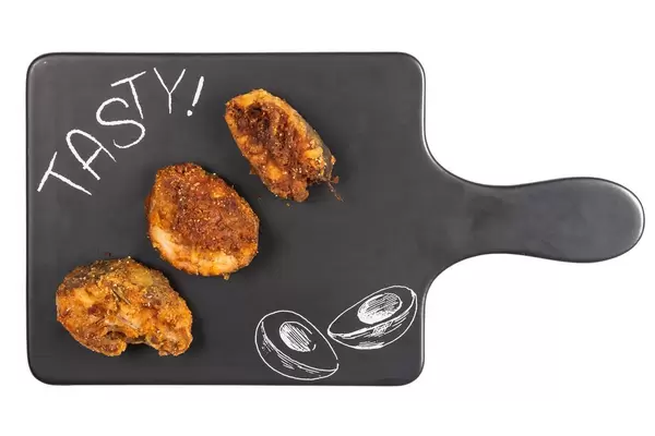 Flat lay above Fried Hake on the black tray