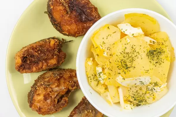 Flat lay above Fried Hake with Potatoe salad