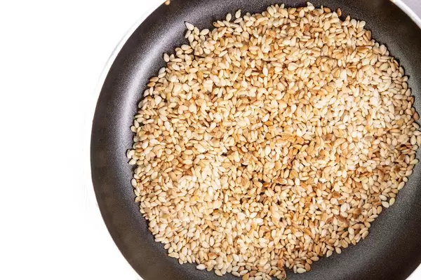 Flat lay above Fried Sesame in the frying pan