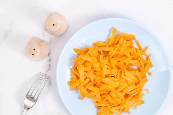 Flat lay above Grated Carrot on the plate