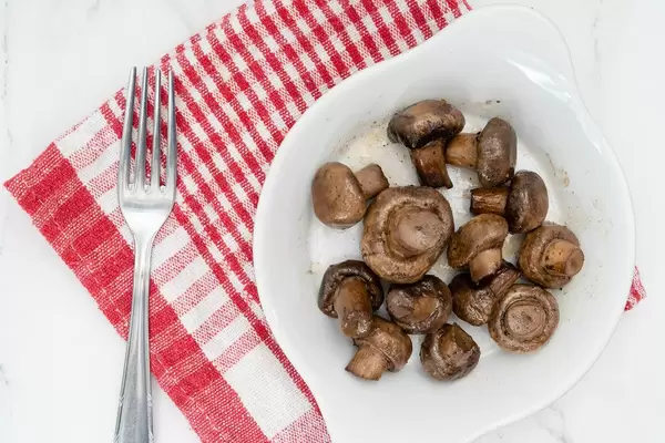 Flat lay above Grilled Mushrooms served in the bowl