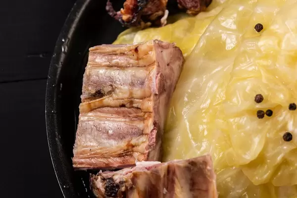 Flat lay above Sauerkraut leaves with Smoked Pork Ribs
