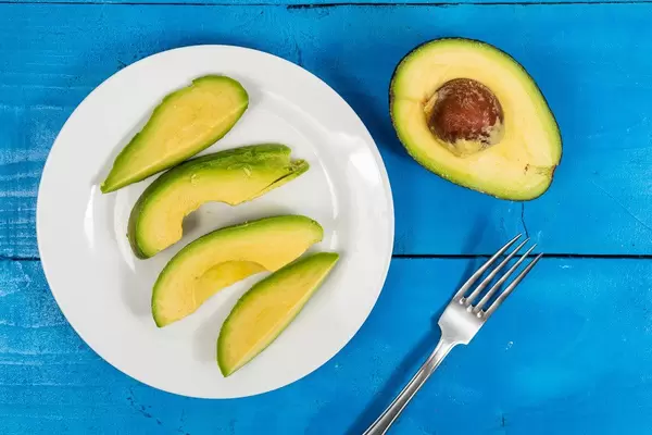 Flat lay above Sliced Avocado on the plate (Flip 2020)