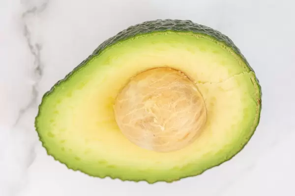 Flat lay above Sliced Avocado