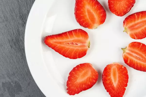 Flat lay above Sliced Strawberries