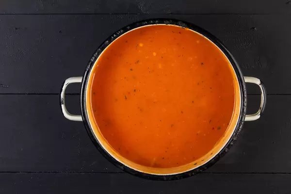 Flat lay above Tomato Sauce in the old rustic bowl