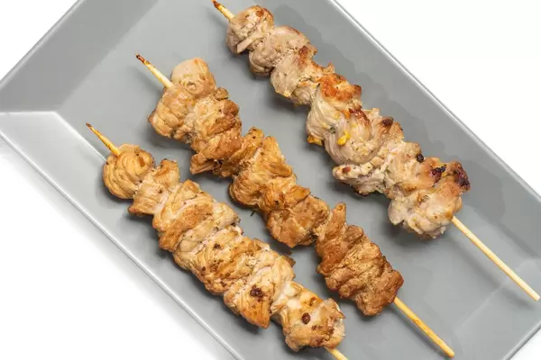 Flat lay above traditional balkan cuisines Raznjici served on the plate