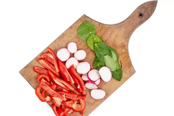 Flat lay abovove Chopped red Paprika Radishes and Baby Spinach