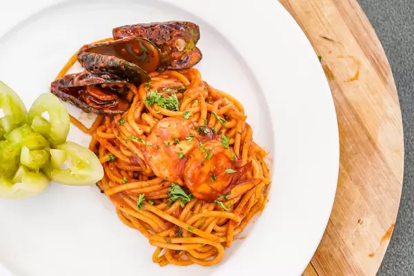 Flat lay shot of seafood spaghetti dish (Flip 2019)